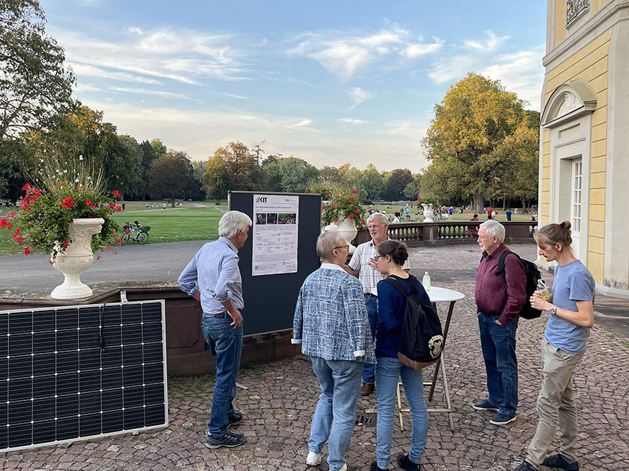 picture showing people and a solar panel